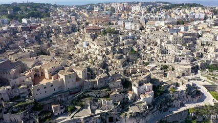 Wall Mural - Panoramic view of the ancient town of Matera (Sassi di Matera) in a beautiful autumn day, Basilicata, southern Italy. Stunning view of the village of Matera. Matera is a city on a rocky outcrop.