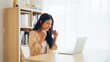 © Monster Ztudio - Funny euphoric young asian woman celebrating winning or getting ecommerce shopping offer on computer laptop. Excited happy girl winner looking at notebook celebrating success