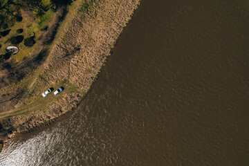 Aerial view drone of two cars on bank river. Concept of Outdoor activity spending time in unity with nature. Getting away. Local travel