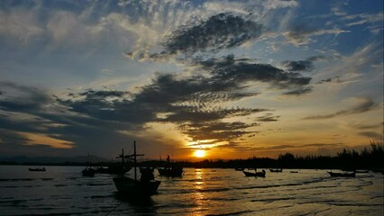 Wall Mural - the sea is calm with the sunset sky and the sun shining through the clouds. the sea in the evening s
