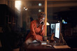 Business, black woman and phone call on smartphone, computer typing and conversation at night. Happy worker, cellphone and communication for desktop management, mobile network and overtime in office