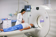 © Laflor/peopleimages.com - Doctor, mri and woman holding hands of patient in hospital before scanning in machine. Ct scan, comfort and medical professional with senior female person in radiology test for healthcare in clinic.