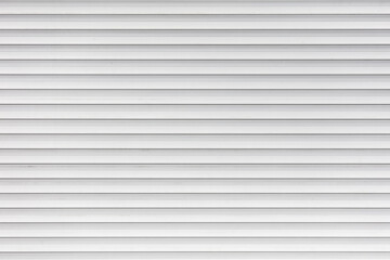 White metal roller shutter door texture background. Texture of white metal roller shutter door