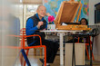 © Cavan Images - Senior retiree painting in the afternoon