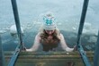 © Cavan Images - woman cold water swimming in the frozen Baltic Sea
