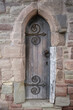 Historical wooden door at the entrance to The Wye Bridge, Monmouth, Monmouthshire, Wales.
