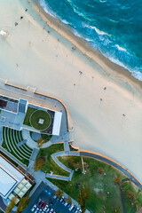 Wall Mural - Aerial top down view of beach and clear blue water. Ocean waves on the beach as a background. Beautiful natural summer vacation holidays background. City Beach, Western Australia. Coastal seascapes