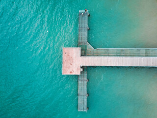 Wall Mural - Aerial view of Coogee Jetty with blue water. Sunny day in summer with turquoise water. Travel to Coogee, Western Australia, Australia. Top view. Coastal, Seascape