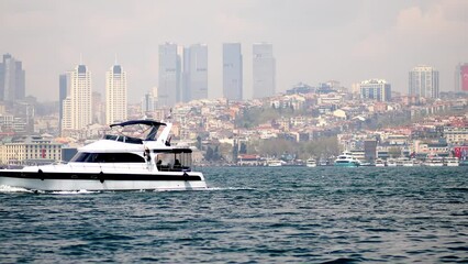 Wall Mural - A passenger ferry sails across the Bosphorus strait in Istanbul, Turkey