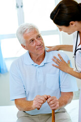 Wall Mural - Support, nurse and old man with cane in hospital for advice, help and rehab at senior care clinic. Healthcare in retirement, counselling and elderly patient with disability on bed with woman doctor