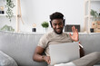 © Egoitz - Young african american man having video call on laptop