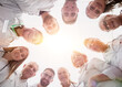 © ASDF - close up. group of doctors standing in a circle and looking at you