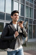 © Cultura Creative - Smiling male student using phone