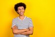 © deagreez - Portrait of cheerful youth guy look empty space arms folded wear striped white black t-shirt isolated yellow color background