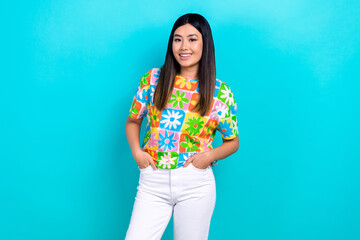 Photo of pretty shiny woman dressed flower print t-shirt smiling hands arms pockets isolated blue color background