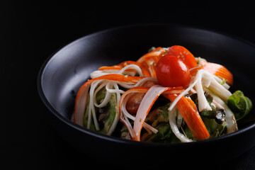 Wall Mural - Japanese salad isolated in black background