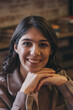 © Tatyana - Portrait of a happy young attractive dark-haired woman in a cafe.