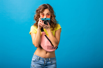 Wall Mural - attractive smiling happy woman posing with vintage photo camera