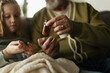 Senior man taking care of his sick granddaughter.