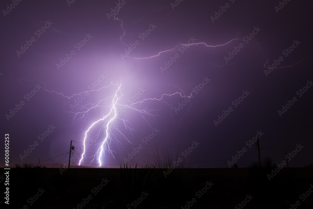 Bolts of lightning strike and splinter off during a monsoon rain storm ...