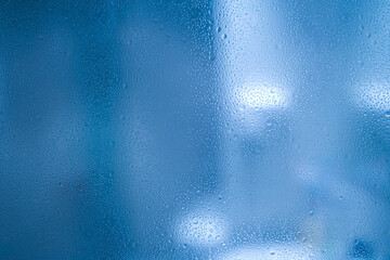 Wall Mural - Waterdrops on glass - abstract background