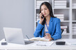 © David - Cheerful employees business Asian woman freelancer making telephone call share good news about project working in office workplace, business finance concept.