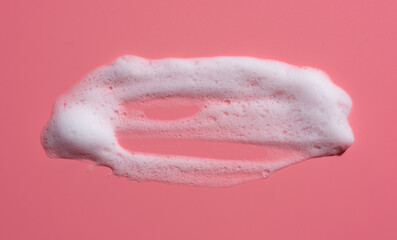 Wall Mural - White soap foam, suds of detergent, cleaning gel or shampoo on pink backdrop