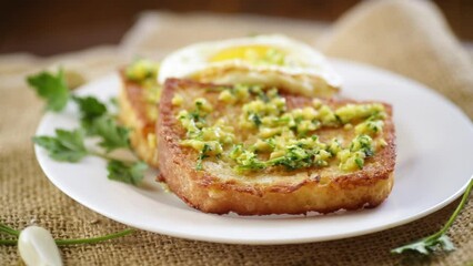 Sticker - Fried croutons in batter with garlic and herbs in a plate.