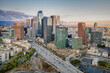 © HunYoung - Los Angeles, California – May 3, 2023: aerial drone view toward LA downtown buildings with freeway 110 including hotel Indigo, Metropolis Los Angeles
