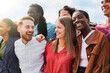 Diverse group of friends having fun smiling outdoor in summer day - Young people celebrate holiday vacations outside