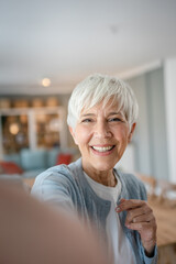 Wall Mural - Close up portrait of one senior woman with short hair happy smile