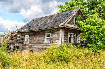 Wall Mural - Countryside landscape with abandoned wooden house