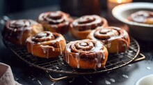 Close-up Of Cinnamon Buns  On Cooling Rack, Drizzled With Icing, Created With Generative Ai. Cinnamon Rolls Or Cinnamon Buns