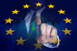© New Africa - Stock exchange. Double exposure with European flag and man using digital screen with trading graphs
