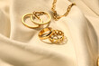 © Pixel-Shot - Beautiful jewellery on white fabric background