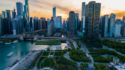 Wall Mural - Chicago IL USA May 4th 2023: aerial drone shot of Chicago downtown metropolitan area during sunset over the lake. the city architecture relates to business travel, urban life and finance 