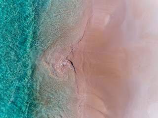 Wall Mural - Aerial top down view of beach and clear blue water. Ocean waves on the beach as a background. Beautiful natural summer vacation holidays background. Eagle Bay, Western Australia. Coastal seascapes