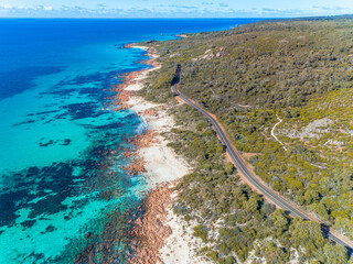 Wall Mural - Aerial top down view of beach and clear blue water. Ocean waves on the beach as a background. Beautiful natural summer vacation holidays background. Meelup road, Western Australia. Coastal seascapes