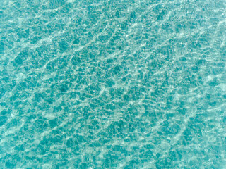 Wall Mural - Aerial top down view of tropical turquoise water. Ocean waves background. Beautiful natural summer vacation holidays background. Swimming in Western Australia. Coastal seascapes