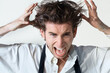 © Kobus Tollig/peopleimages.com - Crazy, scream and portrait of business man on white background with stress, frustrated and anger. Mental health, depression and face of male worker shouting, stressed out and messy hair in studio