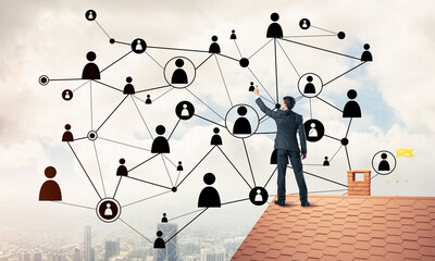 businessman on house roof presenting networking and connection c