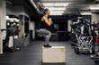 © Dusan Petkovic - A fit sportswoman is jumping on a box in a gym during her cardio training.
