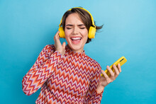 Photo Of Funky Funny Woman Dressed Striped Top Listening Songs Modern Device Isolated Blue Color Background