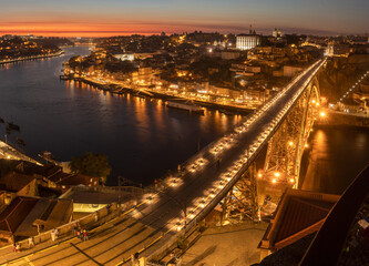 Wall Mural - View over the D. Luís bridge and the city of Porto at dusk from the Serra do Pilar viewpoint in Vila Nova de Gaia, Portugal.