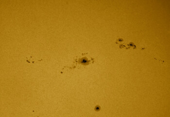 Wall Mural - closeup on the suns surface with sunspots on 9th of may 2023