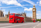 Fototapeta Big Ben - Red bus on Westminster bridge next to Big Ben in London, the UK.