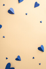 Wall Mural - Celebrate Father's Day with style! Top view vertical flat lay of paper hearts composition on a beige background with an empty frame for text or advert