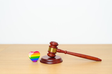 LGBT Law and Pride month concepts. gavel justice hammer with rainbow colorful heart shape for Lesbian, Gay, Bisexual, Transgender, Queer, Intersex, Asexual, Agender, Non Binary, Two Spirit, Pansexual