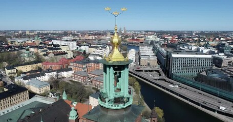 Wall Mural - Stockholm City Hall Roof and Golden Crowns on the Top. Sweden. Drone 4k