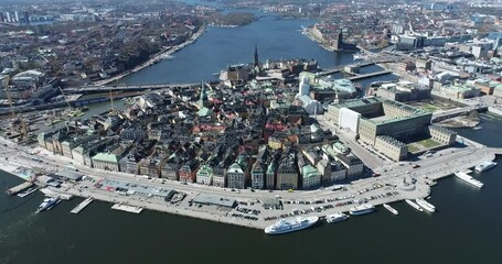 Canvas Print - Stockholm Old Town and One of the most Famous City Island in Background. Sweden. Drone Point of View.